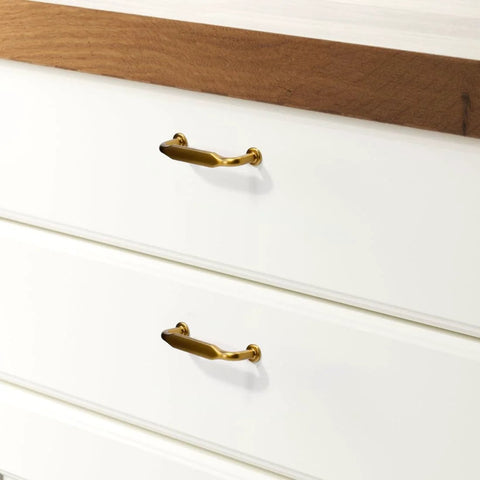 Six Pack Champagne Bronze Cabinet Pulls 3 Inch Hole Center Solid Zinc Alloy Dresser Drawer Handles installed on white drawers