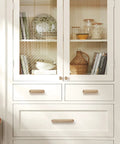 Champagne Bronze Cabinet Pulls 3 Inch Hole Center Circle Drawer Handles Zinc Alloy Hardware installed on white cabinet drawers.