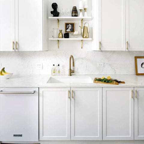 White kitchen with Champagne Bronze Cabinet Pulls 10 Pack 3 Inch Hole Center Zinc Alloy Handles installed on cupboards and drawers.