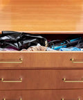 Set Of 6 5 Inch Center To Center SleekTouch Champagne Bronze Cabinet Pulls installed on wooden drawers.