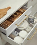 Set Of 6 5 Inch Center To Center SleekTouch Champagne Bronze Cabinet Pulls installed on kitchen drawers