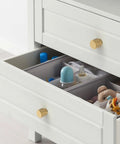 Champagne Bronze Zinc Alloy Knurled Dresser Knobs on a white dresser drawer, showcasing durable solid knob handles for cabinets and drawers.