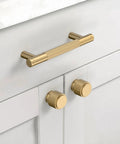 Champagne Bronze Zinc Alloy Knurled Dresser Knobs 20 Pack Cabinet Hardware installed on white cabinets and drawers.