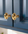 Champagne Bronze Oval Cabinet Knobs 10 Pack Single Hole Cabinet Pulls for Dresser and Kitchen Cabinets installed on blue doors