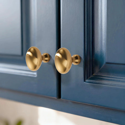 Champagne Bronze Oval Cabinet Knobs 10 Pack Single Hole Cabinet Pulls for Dresser and Kitchen Cabinets installed on blue doors