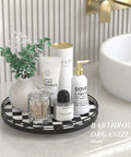 12 Inch Round Black And White Checkered Lazy Susan Turntable with bathroom essentials next to a sink.
