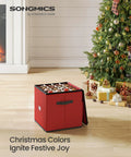 Cherry Red Christmas Ornament Storage Box With 64 Slots For 3 Inch Ornaments near decorated Christmas tree.