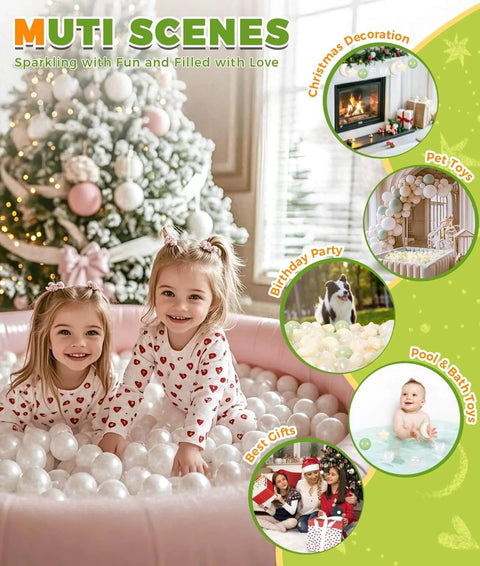 Two children in pajamas playing in a ball pit filled with white balls, Christmas tree in the background, festive decorations visible.