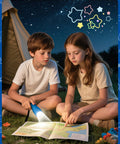 Children using a 9-LED Flashlight from a 6-Pack with Lanyards in Assorted Colors for camping at night, reading a map beside a tent.