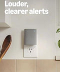 Sleek white chime plugged into wall, offering enhanced audio for real-time alerts; Chime Newest Model With Enhanced Audio For Real Time Alerts You Can Hear From Anywhere Easy Plug In Setup Simple WiFi And Bluetooth Connectivity Sleek White Design And Clear Louder Notifications Throughout Your Home
