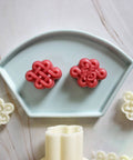 Hand Pressed Chinese Knot Cookie Molds For Flexible Plastic Pastries And Desserts 3D Pattern Baking Mold on display