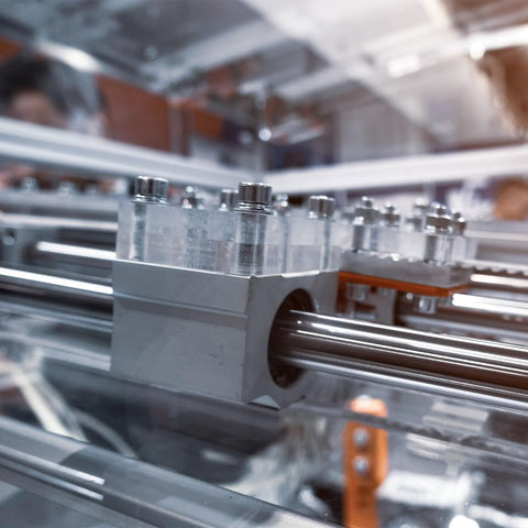 Close-up of linear guide shafts in motion on CNC machine, featuring Beefy 2 Pack 5mm x 200mm high precision chrome plated steel rail.