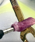 Close-up of tool applying Chrome Plating Kit With Brush System 24K Gold Solution to metal, showing gold finish on a wrench.