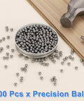 Boss Grade Chrome Steel Balls 5mm G25 Precision 200 Count For Ball Bearings Machinery Automotive And DIY Mirror Finish And Superior Wear Resistance By Uxcell displayed in a container with tools.