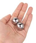 Close-up hand holding 1 Inch Precision Chrome Steel Bearing Balls, 6 Piece Set G25 Pro Grade High Hardness Corrosion Resistant