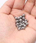 Hand holding 490Pcs Bicycle Bearing Balls Kit Six Sizes Precision Chrome Steel Balls Assortment