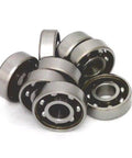 Close-up of 16 inline/Rollerblade/Skate Bearing Chrome Steel Open Ball bearing - Nylon Cage stacked together.