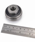 Chrome Steel Insert Ball Bearings UC201-8 Bore Half Inch Sealed With Set Screw Pre Lubricated with ruler for size reference.