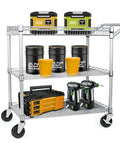 Built Tough 990 Lb Capacity Heavy Duty Rolling Utility Cart For Kitchen And Restaurant NSF Commercial Grade Metal Trolley With Wheels Handle Bar And Shelf Liner Anti Rust Chrome Finish For Easy Serving And Storage, loaded with tools and paint buckets on a white background