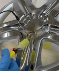 Applying 24K gold finish to a chrome automotive wheel with a Chrome Plating Kit With Brush System 24K Gold Solution Three Step Process.
