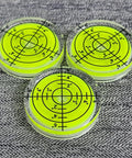 Three Pack Small Circular Bubble Levels 32x7mm Acrylic Round Spirit Level For Layout Tools on grey fabric
