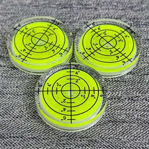 Three Pack Small Circular Bubble Levels 32x7mm Acrylic Round Spirit Level For Layout Tools on grey fabric