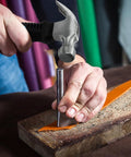 Person using 8oz Claw Hammer For Camping DIY Projects Ergonomic Anti Slip Grip Compact Nail Hammer With High Carbon Steel Head.