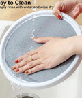 A person rinsing a 10 Inch Lazy Susan Turntable for Kitchen Cabinets and Refrigerators in a sink, highlighting easy cleaning.