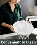 Person washing 10 Inch Marble Lazy Susan with silent rotation for countertop kitchen organization, showing natural marble texture.