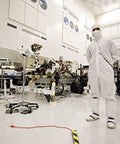 Technician in cleanroom with No Fuss Anti Static ESD Marking Tape For Cleanrooms, Durable Vinyl Black Tape applied on floor.