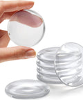 Hand holding a STRONGEST HOME Wall Protector for Door Knobs, 2-Inch - Clear Self-Adhesive Door Stopper Guard, 6-Pack, showing thickness