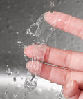 Heavy Duty Double Sided Tape Half Inch By 10 Feet Clear Acrylic Mounting Tape shown as washable and reusable on fingers under water