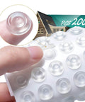 Close-up of 200 Pack Self Adhesive Cabinet Door Bumpers Pads Clear Soft Rubber Circular Dots For Cupboards Drawers Tables Laptop Lids Sound Dampening Anti Slip Easy Peel And Install