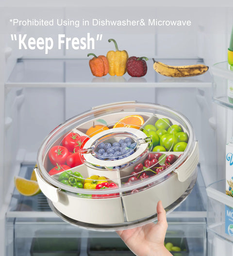 Hand holding Divided Rotating Serving Tray With Lid And Handle 12 Inch Clear Lazy Susan Organizer filled with fruits in a fridge