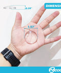 Clear Eight Pack Door Stopper Wall Protector With Adhesive Gel Bumpers in hand, displaying 1.57 inch diameter and 0.39 inch thickness.