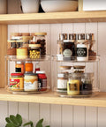 2 Pack Double Layer Lazy Susan Turntable Organizer 9.25 Inch Rotating Spice Rack, stacked and filled with spices on wooden shelf
