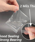 Hand holding a 400 Pcs Clear 3x4 Inch Jewelry Bag 2 Mil Resealable Zip Bag, showcasing thickness and resealable feature for storage.