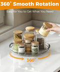 Two Pack 9.25 Inch Lazy Susan Organizer Turntable with spices and canned goods on counter showcasing 360 degree rotation