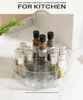 2 Pack 9 Inch Lazy Susan Organizer With 4 Removable Bins holding spice jars on kitchen counter