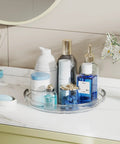Two Pack 9.25 Inch Lazy Susan Organizer Turntable displaying skincare bottles and toiletries on a bathroom countertop