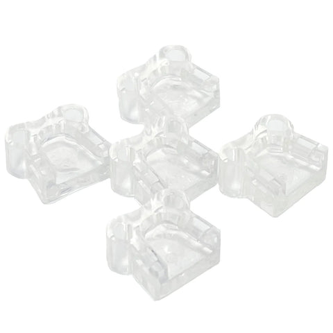 Five clear inserts from the No-Mar Tip Replacement Set for DCN Series that shields wood surfaces by snapping over nailer nose.