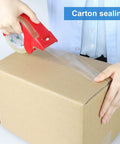 Person using Heavy Duty Clear Packing Tape 2 Rolls With Refillable Dispenser Noiseless 1.88 In X 55 Yards Shipping Tape on box