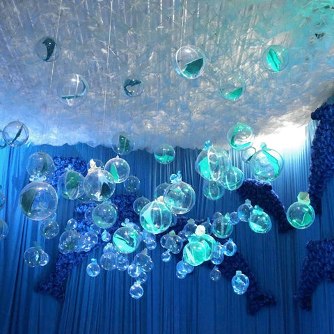 Decorative blue-lit ceiling arrangement with 20 Pack 4-Inch Clear Plastic Fillable Ornaments Ball for Christmas, Wedding, Party, Home Decor.