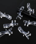 12 Pack Hidden Channel Valance Clips 1-7/8 Inch Clear Plastic Clips For Valance With Groove In Back on dark surface