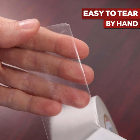 Close-up of hand tearing Clear Double Sided Tape Removable 1.5 Inch By 30 Yards A Real Workhorse For Gift Wrapping and more