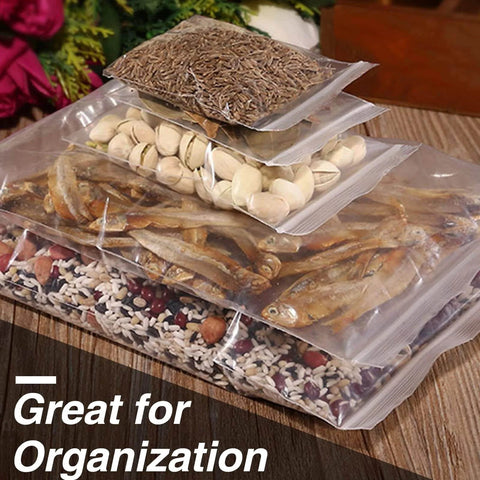400 Pcs Clear 3x4 Inch Jewelry Bags 2 Mil Resealable Zip Bags storing various dry foods on a wooden table