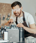 Man wearing Clear Z87.1 Certified Safety Glasses For Work Lab Scratch Resistant 30 Pcs in workshop setting