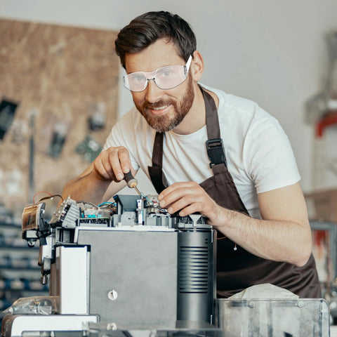 Man wearing Clear Z87.1 Certified Safety Glasses For Work Lab Scratch Resistant 30 Pcs in workshop setting