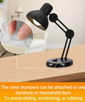 Clear Self Adhesive Cabinet Bumpers For Kitchen Cabinets And Doors shown on a desk lamp base, highlighting installation ease.