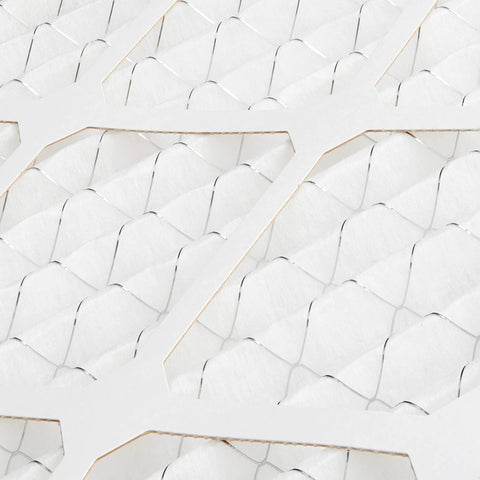Close-up view of MERV 8 furnace air filter material with electrostatic design, trapping dust, pollen, and lint for allergy relief.